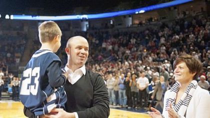 Penn State's new football coach Bill O'Brien is introduced with his son, Michael, 6, and wife, Colleen, during the first half of the Nittany Lions basketball game Sunday against Indiana.