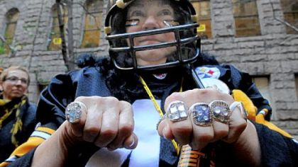 Marlene Campen of Plum shows off her homemade  championship rings Friday during the Steelers rally at the Allegheny County Courthouse, Downtown.