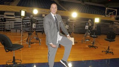 ESPN College GameDay basketball analyst Jay Bilas, dressed for the waist up on camera shots, goofs around on a partially broken-down set Friday, a day before the show goes live. The show travels around the country to a new destination each week, and Saturday's show featured the Pitt vs. Louisville matchup at Petersen Events Center.