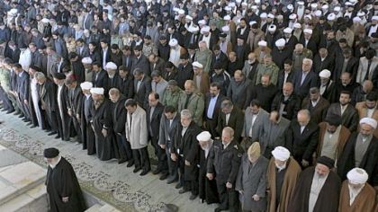 Iranian supreme leader Ayatollah Ali Khamenei, left, prepares to deliver his Friday prayers sermon at Tehran University. In his remarks, the ayatollah called Israel a "cancer tumor on this region that should be cut off. And it definitely will be cut off."