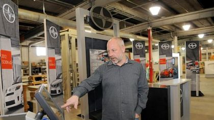 John Pugh, director of the automotive group at Czarnowski on the North Side, shows a display for the automaker Scion. Czarnowski is an international exhibit design and fabrication firm.