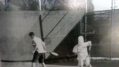 John Shick, left, warms up with a teammate on Long Beach Polytechnic High School's tennis squad. Photo from the school's 1999 yearbook.