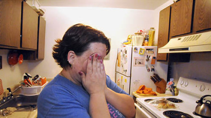 Lori Celani cries as she learned she's found another apartment. She is one of 18 tenants being forced to move quickly after their apartment building along McClure Avenue in Swissvale was condemned.