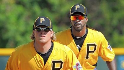 Nate McLouth, foreground, and Andrew McCutchen work on their baserunning y.
