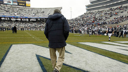 In this Nov. 27, 2010, file photo, Penn State coach Joe Paterno walks on to the field at Beaver Stadium for warm ups before a game against Michigan State.
