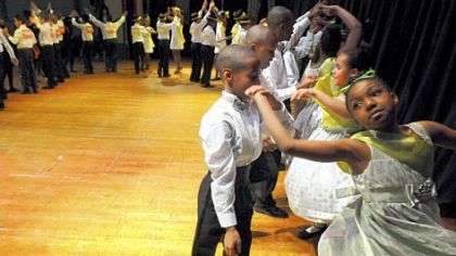 A team from Pittsburgh Miller PreK-5 competes in a team dance competition at Pittsburgh Allderdice High School on Saturday.