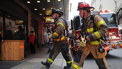 Firefighters respond to a fire on the ninth floor of the Roosevelt Arms building on Penn Avenue in Downtown Pittsburgh.