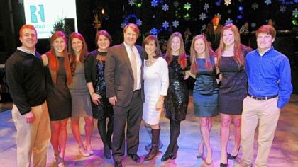 Rich Fitzergerald stands with his wife Cathy, and, from left, their 8 children Tanner, 21, Mara, 16, Louisa, 18, Erin, 24, Jocelyn, 25, Caroline, 22, Madeline, 20, and Jackson, 15.