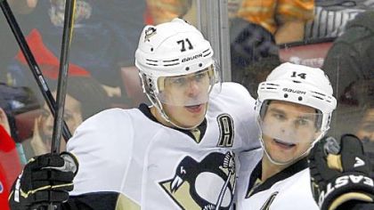 Penguins center Evgeni Malkin celebrates his goal with teammate Chris Kunitz during the second period of a game against the Florida Panthers last month in Sunrise, Fla.