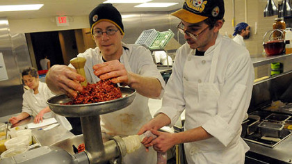 Lake Fong/Post-GazetteAndrew Sluk, left, and Justin Lewis of Legume Bistro in Oakland make pepperoni on Thursday, December 29, 2011. Magazine. China Millman.  PUBLISHED CAPTION: Lake Fong/Post-GazetteAndrew Sluk, left, and Justin Lewis of Legume Bistro in Oakland make pepperoni.