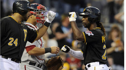 Andrew McCutchen is congratulated by Pedro Alvarez after hitting his first home run of the season.