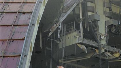 Blow torches are used to help loosen a roof section of the Civic Arena that wouldn't budge Tuesday as part of the ongoing demolition of the 51-year-old structure.