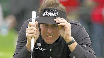 Phil Mickelson lines up a shot on the 15th green during the final round of the AT&T Pebble Beach National Pro-Am Sunday in Pebble Beach, Calif. Mickelson went on to win the tournament by finishing at 17 under.