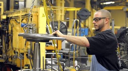 Ron Safran assembles an air compressor at the Wabtec factory in Wilmerding. The rail equipment supplier reported nearly $2 billion in revenue last year.
