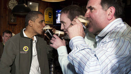 President Barack Obama drinks a Guinness Saturday with his ancestral cousin from Moneygall, Ireland, Henry Healy, center, and the owner of a pub there, Ollie Hayes, at The Dubliner Restaurant and Pub in Washington on St. Patrick's Day.