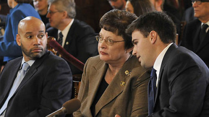 After taking the oath of office, new Councilman Corey O'Connor has a word with Darlene Harris, who was re-elected Pittsburgh City Council president.