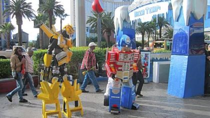 Entertainers dressed as pop culture characters -- here they are Transformers -- troll for tips on the Strip.