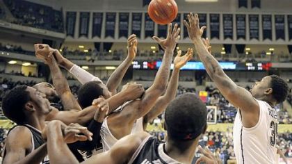 Pitt's Nasir Robinson reaches for a rebound against Providence in the second half Wednesday at Petersen Events Center.