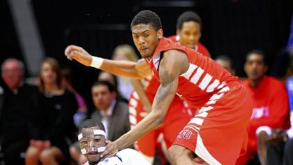 A loose ball eludes Robert Morris' Velton Jones, left, and Saint Francis' Earl Brown Saturday.