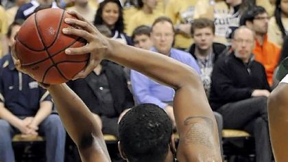 Pitt's J.J. Moore is flattened by South Florida's Ron Anderson Jr. in the first half Sunday at Petersen Events Center.