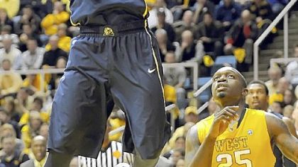 Ashton Gibbs takes the ball to the basket against West Virginia's Darryl Bryant in the second half Monday in Morgantown, W.Va.