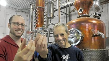 Eric Meyer, left, and his father, Mark, at their Wigle Whiskey distillery on Smallman Street in Pittsburgh's Strip District.