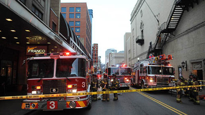 Firefighters respond to a fire on the ninth floor of the Roosevelt Arms building on Penn Avenue in Downtown Pittsburgh.
