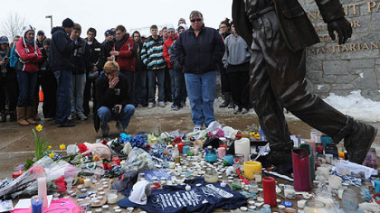 Mourners gather at the Joe Paterno statue outside Beaver Stadium in State College where a makeshift memorial has been set up.