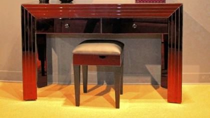 Suede chair with acrylic legs, crystal button tufted back and nail head 
trim arms for Priscilla Presley Home Collection.