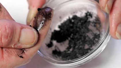 The Rev. Susan Rothenberg of Emsworth United Presbyterian Church mixes palm ashes with a little olive oil for use today on Ash Wednesday.