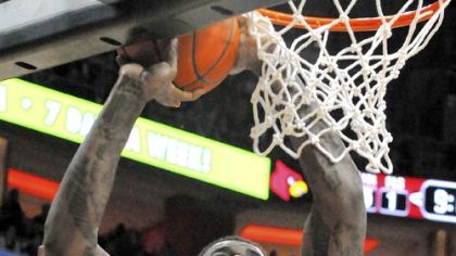 Dante Taylor goes to the basket against Louisville in the first half Sunday in Louisville, Ky.