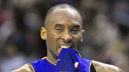 Lakers guard Kobe Bryant bites his jersey in the team's game against the Raptors Sunday in Toronto. Bryant hit a shot with 4.2 seconds left to lead the Lakers to a 94-92 win.