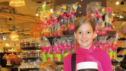 Mason and Chloe Spikula, of Mt. Lebanon, with 5-kilo containers of Nutella at the food hall of Le Bon Marche in Paris.