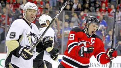The Devils' Zach Parise, right, reacts after scoring a goal as Pascal Dupuis looks on Sunday in Newark, N.J.