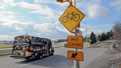 The Montour Trail's Airport Connector crosses Airport Boulevard. Warning lights protect the crossing.