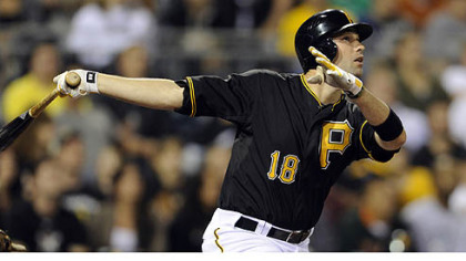 Neil Walker hits a sacrifice fly to score the go-ahead run against Washington in the eighth inning Tuesday night at PNC Park.