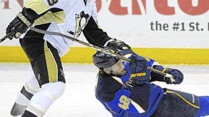 Steve MacIntyre, just called up from Scranton/Wilkes-Barre, is called for tripping the Blues' David Backes in St. Louis Tuesday night == the Penguins' final game before the All-Star break.