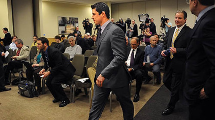Sidney Crosby walks to the podium to address members of the media during a press conference to update his status at the Consol Energy Center.
