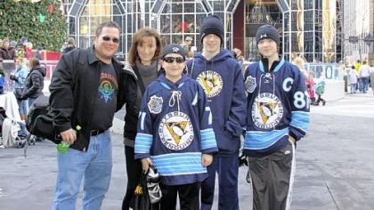 Sunny Carney with her husband, Mark, and, from left, sons Nolan, 13; Austen, 15; and Logan, 14.