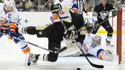 Islanders Evgeni Nabokov makes a diving save on  Pascal Dupuis in the third period.
