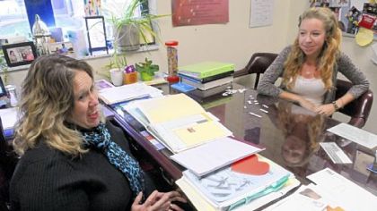 West Mifflin Area High School counselor Jennifer Shields, left, advises students such as senior Caitlin Hawthorn to have college applications done by Thanksgiving.