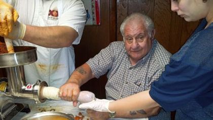 Patsy Pizzuto, Michael Pizzuto's grandfather, stuffs what they call a "supersud" -- sopressata -- in Pitcairn.