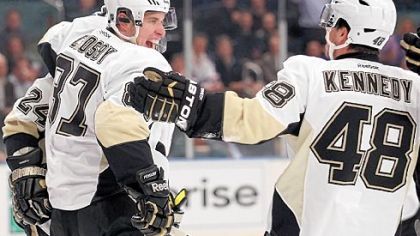 Sidney Crosby celebrates with Matt Cooke and Tyler Kennedy against the New York Rangers at Madison Square Garden tonight.