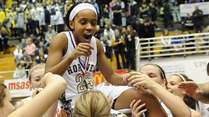 Hopewell's Jharrin Gill is lifted by her teammates after the Vikings defeated South Park for the Class AAA title Saturday.