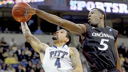 Cincinnati's Justin Jackson blocks a shot by Pitt's John Johnson in the second half Sunday night at Petersen Events Center.