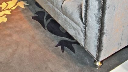 Pearl finish leather sette from the Priscilla Presley Home Collection.
