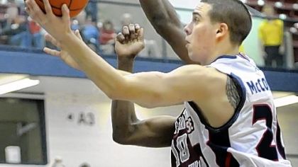 Duquesne's T.J. McConnell drives for two of his game-high 28 points Wednesday.