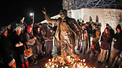People gathered Saturday night around a statue of Joe Paterno outside Beaver Stadium on the Penn State University campus.
