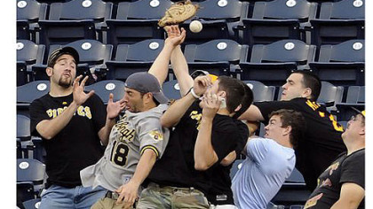 Pirates fans try to catch a home run ball hit by Washington's Wilson Ramos in the third inning Tuesday night at PNC Park.