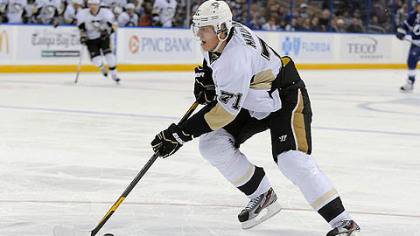 Penguins center Evgeni Malkin charges the net to score his second goal of the third period against the Tampa Bay Lightning. Malkin had three goals and two assists as the Penguins won 6-3.
